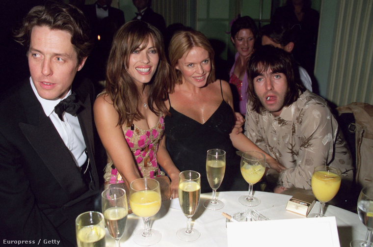 Celebfeleségként Liam Gallagher oldalán, itt Hugh Granttal és Elizabeth Hurley-vel 1999-ben egy filmpremier afterpartiján